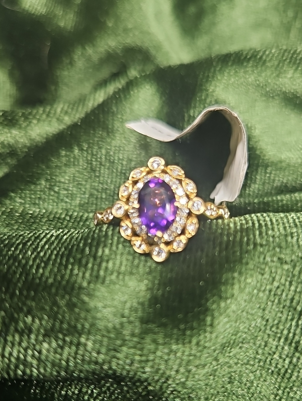 Gold Ring with Purple Oval Gem and Halo Accents